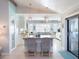 Modern kitchen featuring white cabinets, butcher block counters, and a cozy dining nook at 30 Jamestown Ave, Englewood, FL 34223