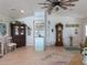 Open-concept living area with wood floors, vintage furniture, and plenty of space at 30 Jamestown Ave, Englewood, FL 34223