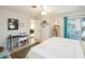 Bright main bedroom featuring a ceiling fan, ensuite sunroom and a decorative rug at 30 Jamestown Ave, Englewood, FL 34223