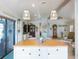 Bright, open living area features an island and flows into the adjacent living spaces at 30 Jamestown Ave, Englewood, FL 34223