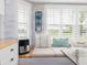 Charming window seat with decorative pillows and shelving, perfect for relaxing and enjoying the natural light at 30 Jamestown Ave, Englewood, FL 34223