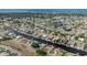 Wide aerial shot of the waterfront community with canal access and neighborhood views to the beautiful bay waters at 314 Oakwood Cir, Englewood, FL 34223