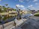 View of boat lift and canal with clear sky at 314 Oakwood Cir, Englewood, FL 34223