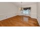 Spacious dining area featuring wood floors, a bay window, and a stylish chandelier at 314 Oakwood Cir, Englewood, FL 34223