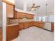A spacious kitchen featuring beautiful wood cabinetry, granite countertops and modern stainless steel appliances at 314 Oakwood Cir, Englewood, FL 34223