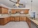 Well-appointed kitchen features wood cabinets, granite countertops, and stainless steel appliances at 314 Oakwood Cir, Englewood, FL 34223