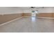 Spacious living room featuring neutral tile flooring and convenient access to the outdoors at 314 Oakwood Cir, Englewood, FL 34223