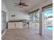 Outdoor kitchen area featuring stainless steel appliances and access to the pool at 314 Oakwood Cir, Englewood, FL 34223