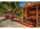 Cozy restaurant exterior with outdoor seating, mature trees, and a vibrant atmosphere at 314 Oakwood Cir, Englewood, FL 34223