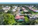 Aerial view of a neighborhood featuring mature trees, well-maintained lawns, and a home with a screened pool at 316 Signorelli Dr, Nokomis, FL 34275