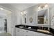 Bathroom with double sinks, granite countertop, and a separate shower at 316 Signorelli Dr, Nokomis, FL 34275