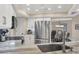 Bright kitchen featuring stainless steel appliances, white cabinetry, and granite countertops at 316 Signorelli Dr, Nokomis, FL 34275