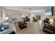 Bright living room featuring tile floors, a dining area, comfortable seating, and lots of natural light at 316 Signorelli Dr, Nokomis, FL 34275