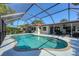 Screened in swimming pool with patio space, landscaping, and a covered patio at 316 Signorelli Dr, Nokomis, FL 34275