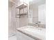 Bright bathroom featuring an undermount sink with a granite counter and decorative shelving at 3255 Beneva Rd # 102, Sarasota, FL 34232