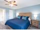 Comfortable bedroom with a large bed, soft lighting, and light blue walls at 3255 Beneva Rd # 102, Sarasota, FL 34232