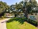 Well-maintained condominium entrance with lush landscaping and clear signage at 3255 Beneva Rd # 102, Sarasota, FL 34232