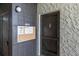 Hallway view of unit entry door with a bulletin board and a 'No Smoking' sign at 3255 Beneva Rd # 102, Sarasota, FL 34232