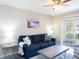 Inviting living room with contemporary furnishings, neutral walls, and a walk-out at 3255 Beneva Rd # 102, Sarasota, FL 34232