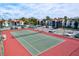 Aerial view of the tennis court surrounded by parking and nearby residential buildings at 3255 Beneva Rd # 102, Sarasota, FL 34232
