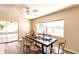 Inviting dining area with a large table, wood floors, and a sliding door to the patio at 3716 Mundy Ridge Dr, Sarasota, FL 34233