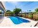 Inviting backyard pool surrounded by a new wooden fence, creating a private oasis at 3716 Mundy Ridge Dr, Sarasota, FL 34233