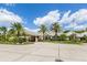 Circular driveway showcasing the well-maintained landscaping and elegant building facade at 396 Lansbrook Dr, Venice, FL 34292