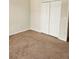 Bedroom with carpet and a closet at 4244 Vicenza Dr # D34, Venice, FL 34293
