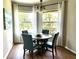 Bright dining area features wood floors, pendant lighting, and a large window at 4244 Vicenza Dr # D34, Venice, FL 34293