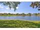 Scenic pond reflecting sky and surrounding residences on a bright sunny day at 4244 Vicenza Dr # D34, Venice, FL 34293