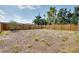 Spacious backyard area with a wooden fence, providing ample space for outdoor activities at 429 Riviera St, Venice, FL 34285