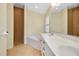 Bathroom featuring a walk-in shower, soaking tub, and double sinks at 429 Riviera St, Venice, FL 34285