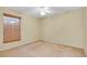 Neutral bedroom with carpet, ceiling fan, and window with blinds at 429 Riviera St, Venice, FL 34285