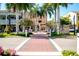 Charming street crosswalk lined with palms between colorful buildings at 429 Riviera St, Venice, FL 34285