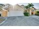 Charming home with an attached garage and neatly landscaped front yard, featuring a well-maintained driveway at 429 Riviera St, Venice, FL 34285