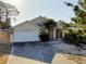 Well-maintained single-Gathering home with a two-car garage, inviting entry, and landscaped front yard at 429 Riviera St, Venice, FL 34285