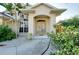 Charming home with a welcoming front entrance, complemented by lush landscaping and a well-maintained walkway at 429 Riviera St, Venice, FL 34285