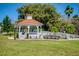 Classic park gazebo features an orange tile roof and well-manicured landscaping at 429 Riviera St, Venice, FL 34285