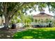 Picturesque gazebo in a lush park setting with mature trees and green grass at 429 Riviera St, Venice, FL 34285