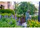 This landscaped garden features colorful flowers, greenery, and a small girl statue at 429 Riviera St, Venice, FL 34285