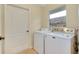 Laundry room with washer, dryer, and window at 429 Riviera St, Venice, FL 34285