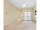 Bright living room with French doors, ceiling fan, and neutral color scheme at 429 Riviera St, Venice, FL 34285