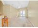 Spacious living room showcasing french doors, a ceiling fan, and neutral decor at 429 Riviera St, Venice, FL 34285