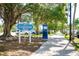 Centennial Park signage with mature trees and well maintained sidewalks at 429 Riviera St, Venice, FL 34285