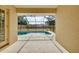 A screened in pool with concrete deck offers outdoor relaxation and enjoyment at 429 Riviera St, Venice, FL 34285