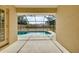 A screened in pool with concrete deck offers outdoor relaxation and enjoyment at 429 Riviera St, Venice, FL 34285