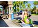 This scenic street view features a mermaid statue alongside businesses in the historic downtown Venice, FL at 429 Riviera St, Venice, FL 34285