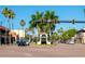 This street view shows historic downtown Venice, FL with palm trees, shops, and the 'Venice' archway at 429 Riviera St, Venice, FL 34285