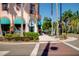 A picturesque street view showing downtown Venice, FL, with palm trees, shops, and a seahorse statue at 429 Riviera St, Venice, FL 34285