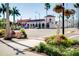 Scenic street view featuring landscaping, hanging baskets, and quaint architecture at 429 Riviera St, Venice, FL 34285